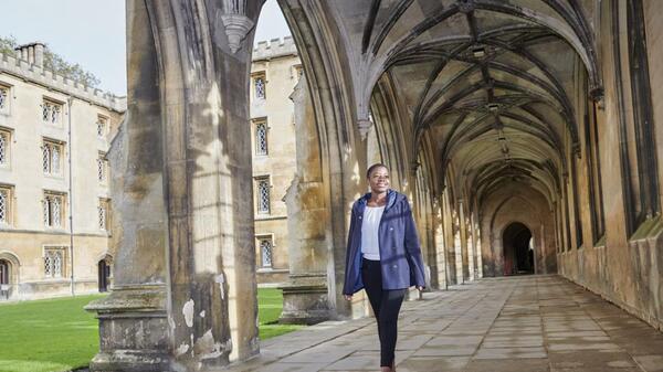 Charity Bhebhe walking the campus of Cambridge
