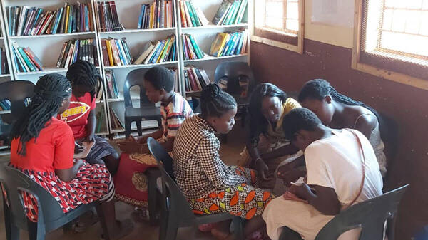Students sitting around taking notes